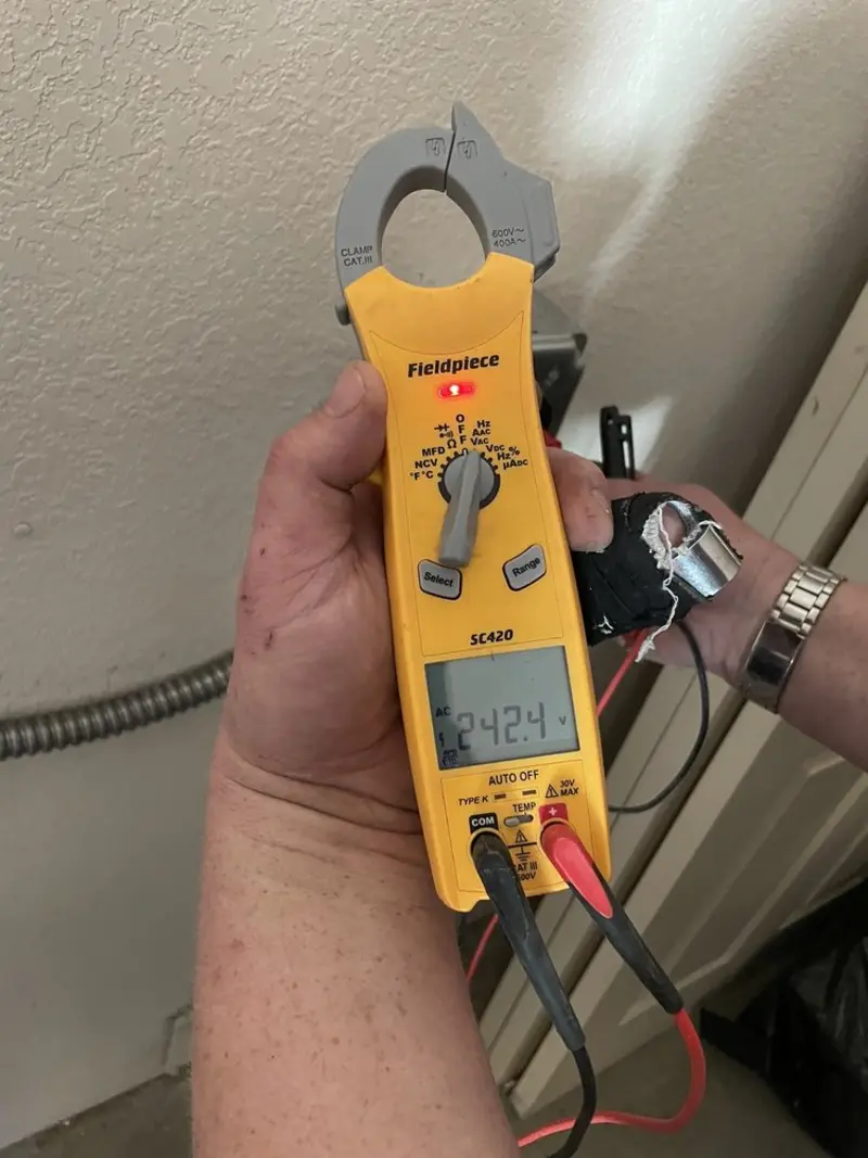 Voltage testing with clamp meter during Electrical Installation Services in McKinney